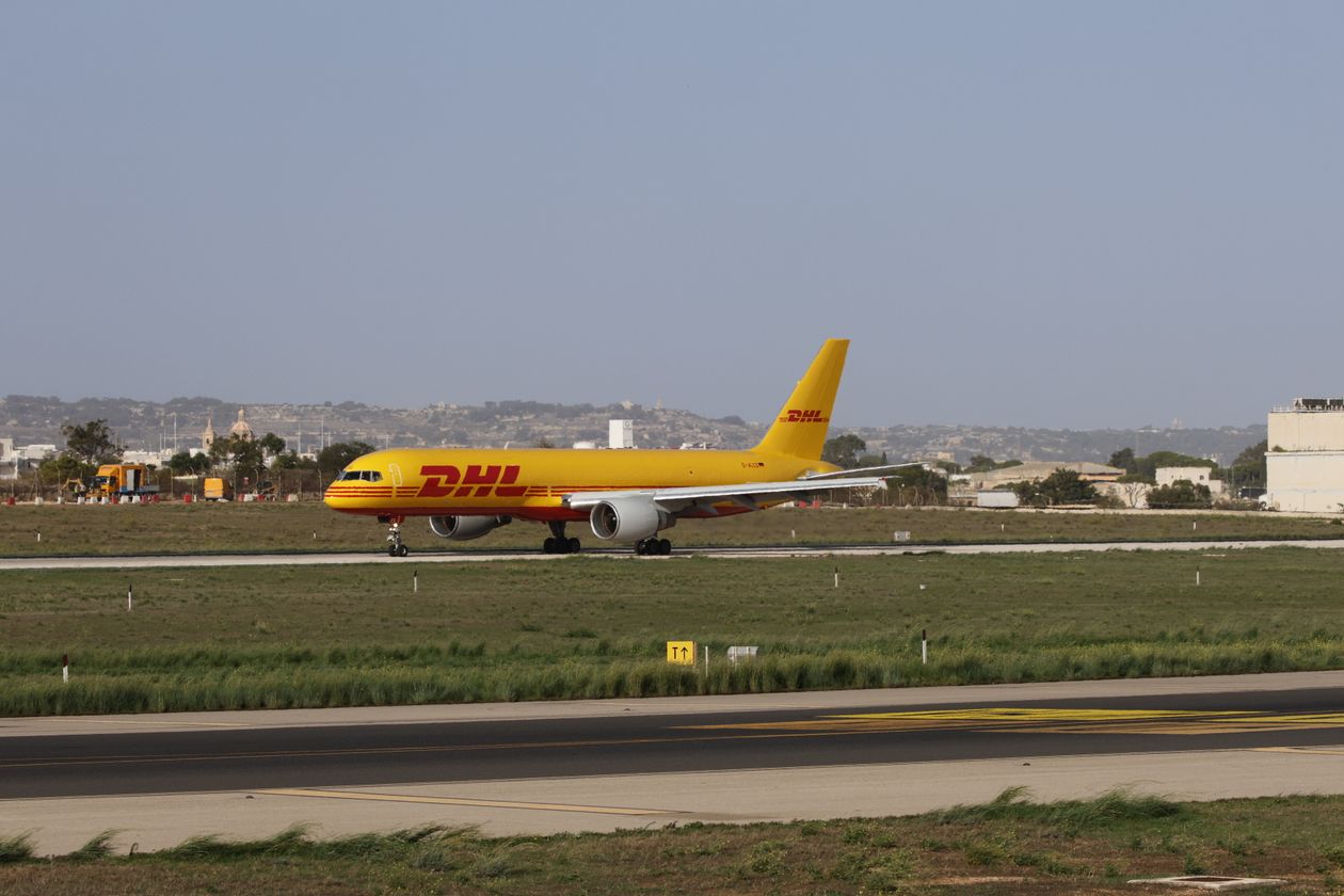 Cargo aircraft on an airport runway preparing for freight loading operations