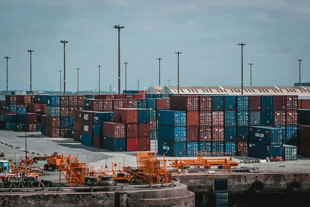Rows of shipping containers in a port storage yard